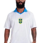 Camiseta Brasil Unissex Gola Polo Branca Casual Elegante | Produto Oficial Licenciado Copa do Mundo FIFA 26™ - Tamanho XG
